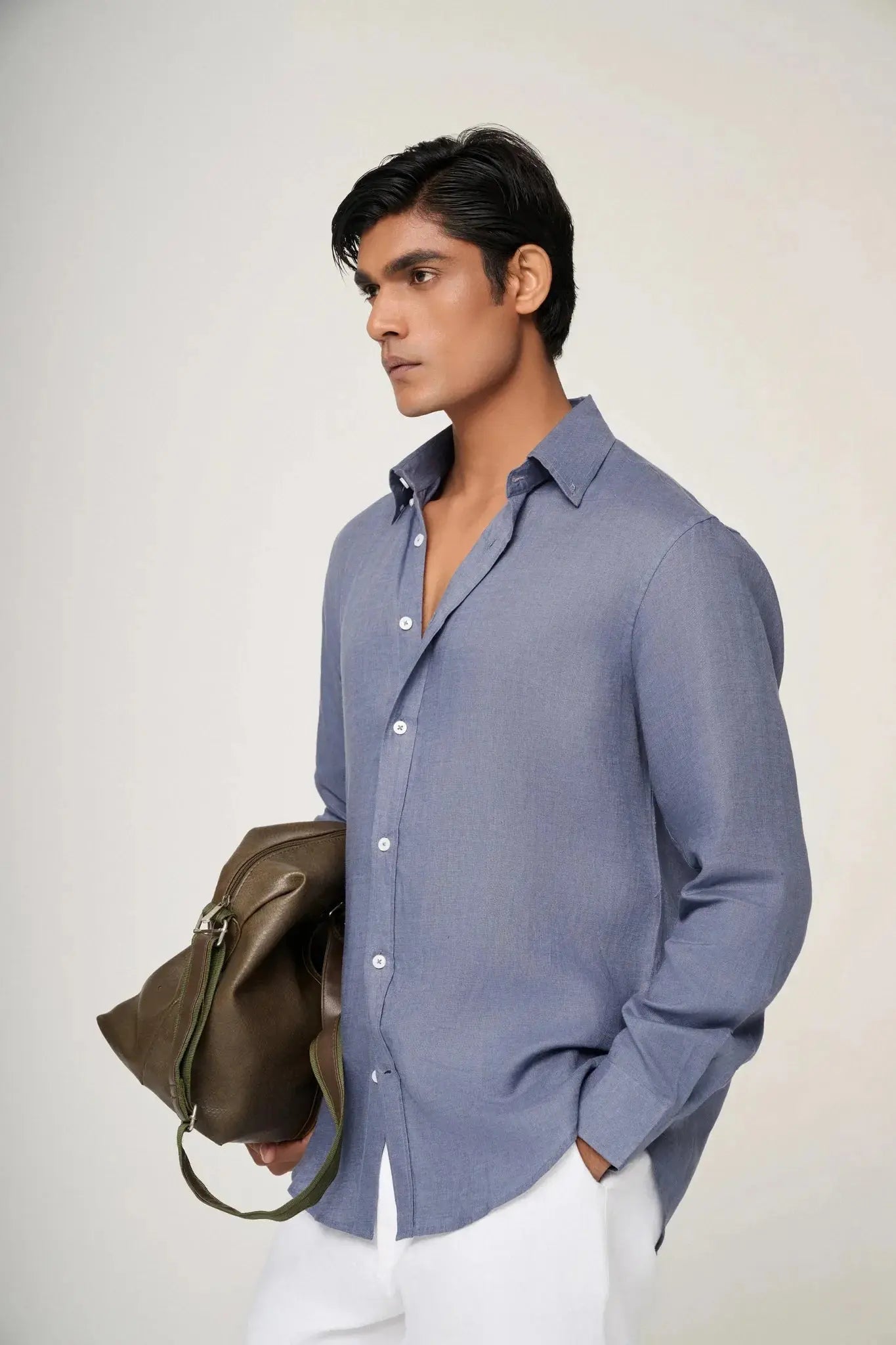 sleeve and button detail on slate blue linen shirt