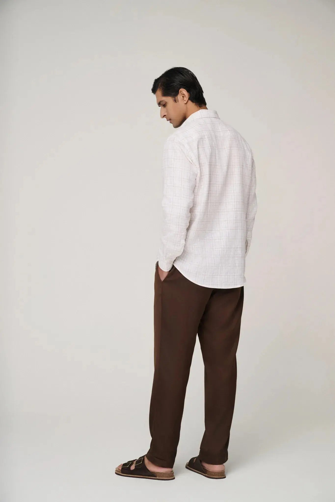 Back view of pink check linen shirt.