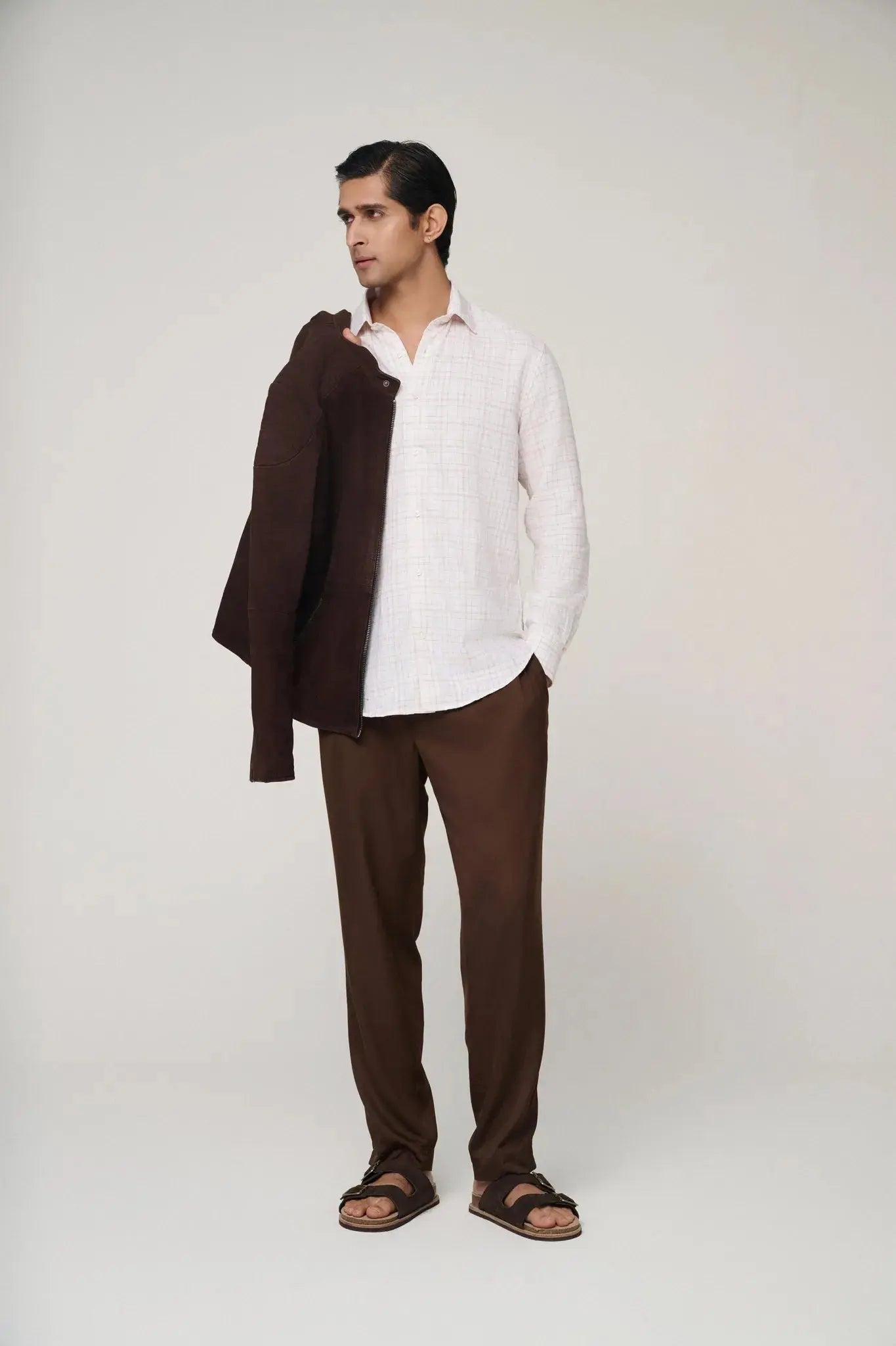 Pink check linen shirt paired with trousers