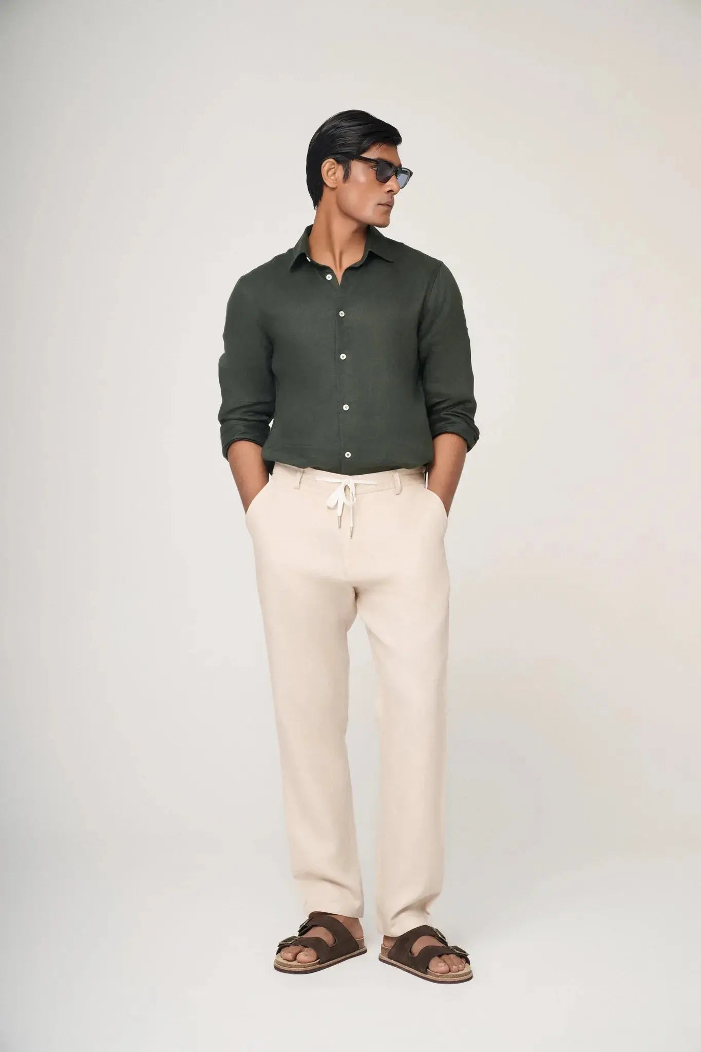 green linen shirt styled casually.