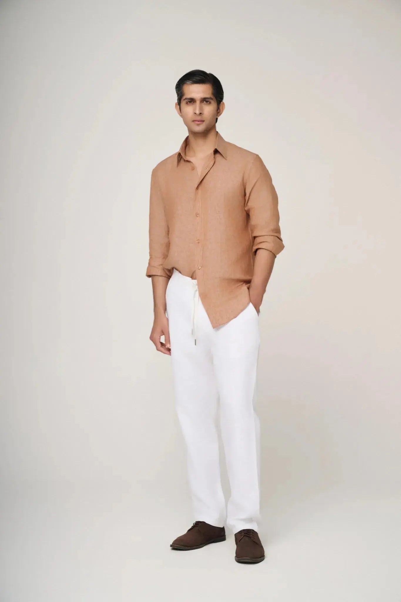 textured light brown linen shirt styled casually.