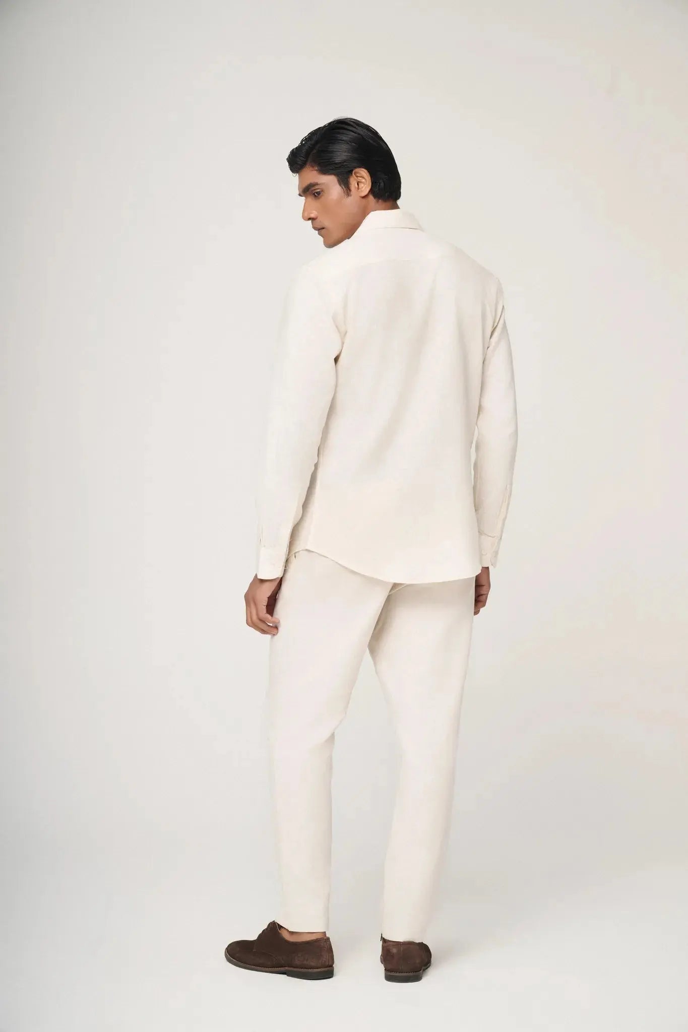 back view of cream linen shirt.