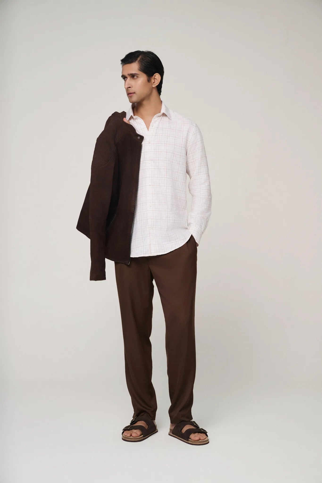 Pink check linen shirt paired with trousers