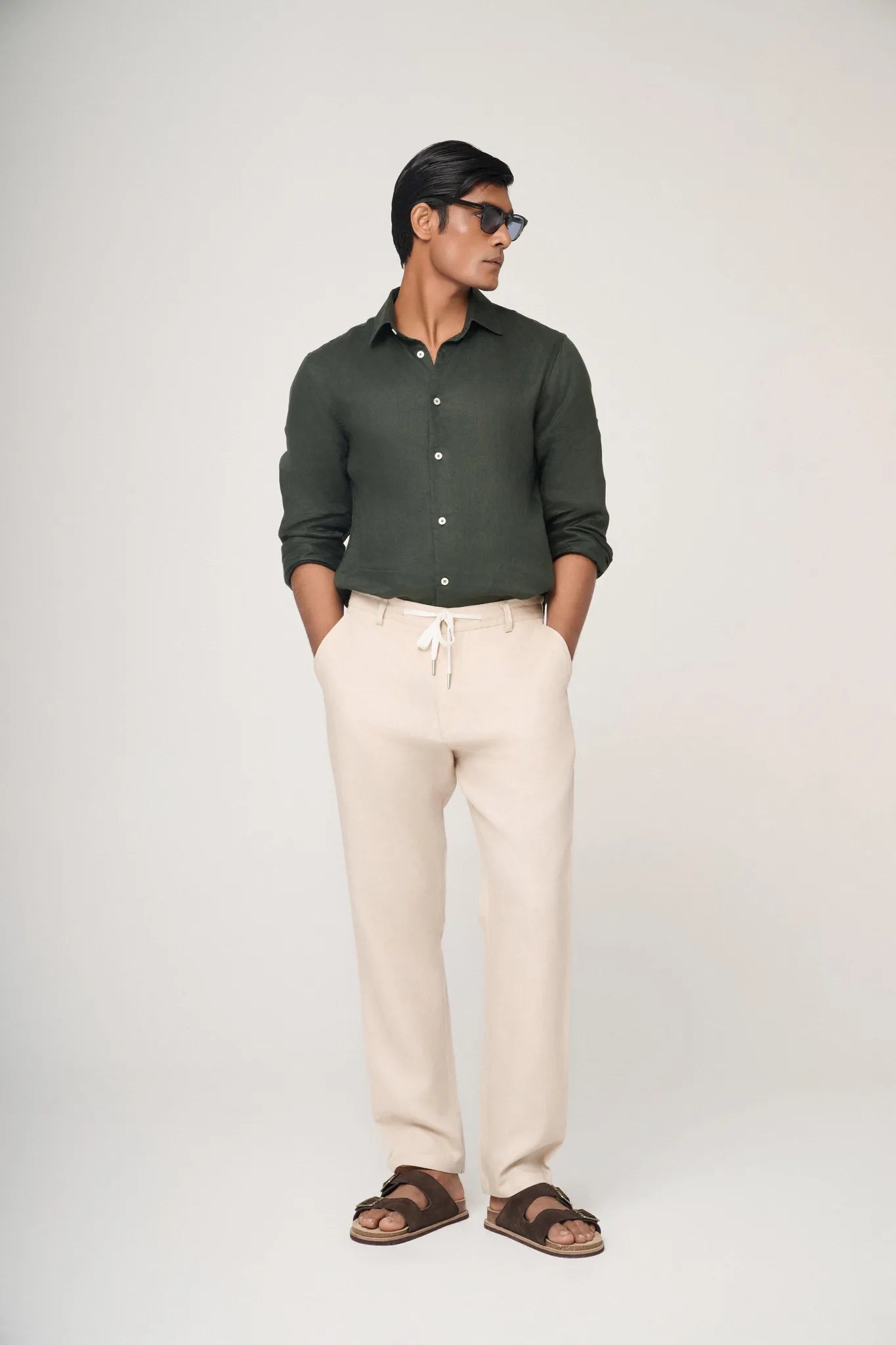 green linen shirt styled casually.