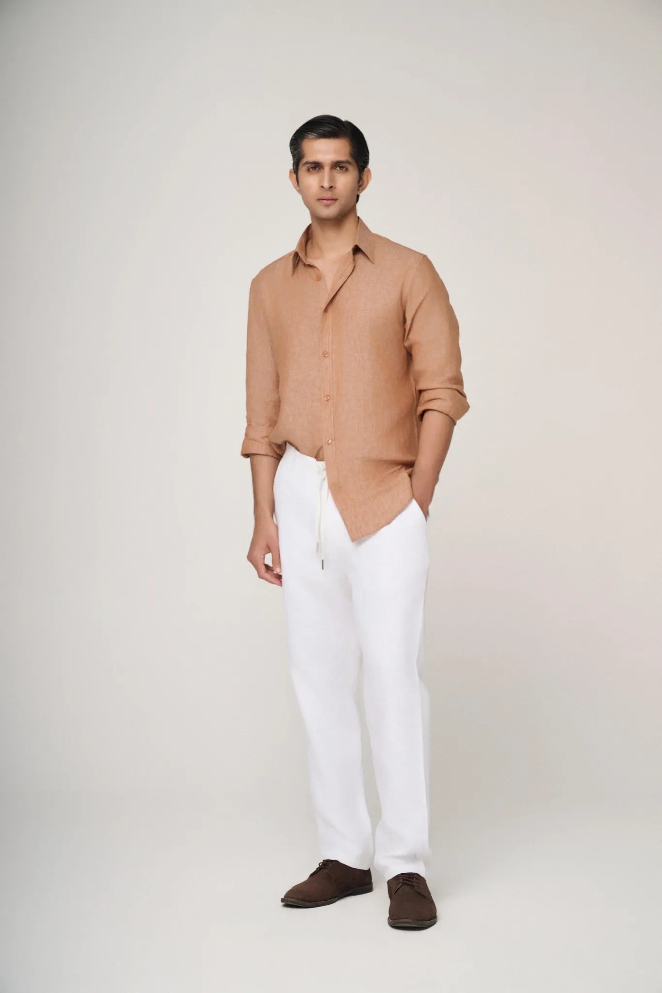 textured light brown linen shirt styled casually.