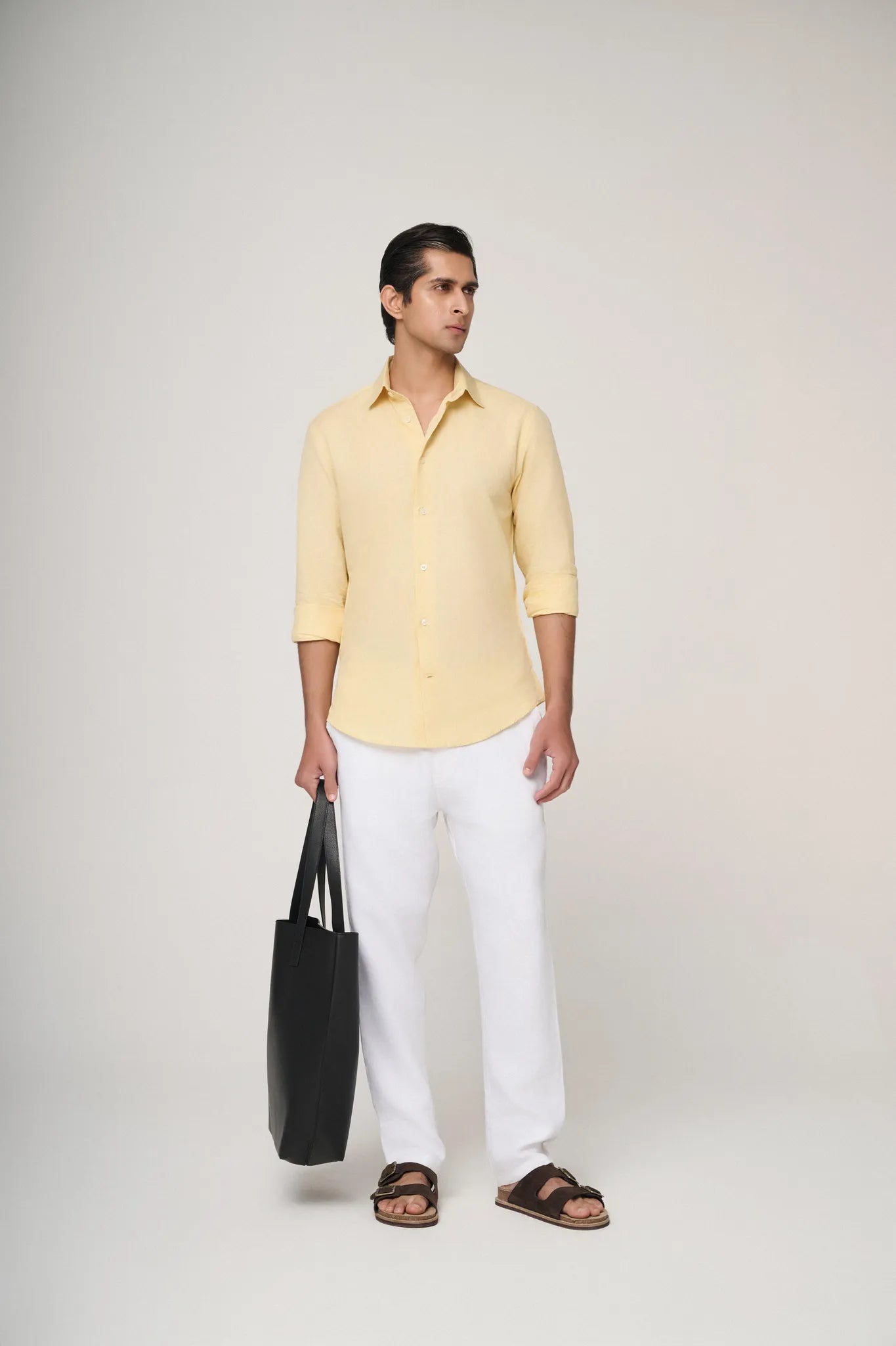 yellow linen shirt styled for bold summer looks