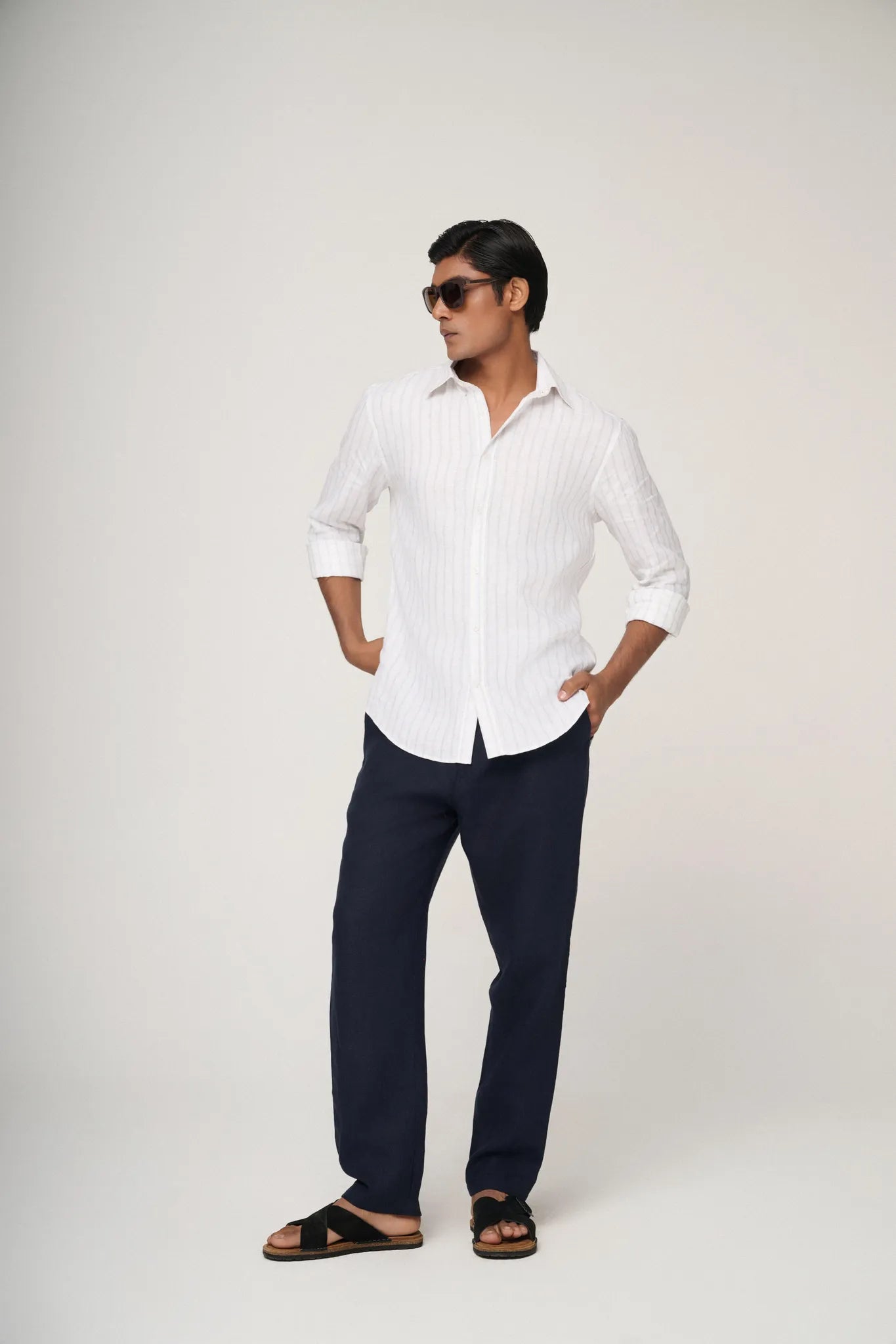 striped linen shirt styled with neutral trousers